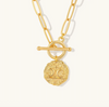 Gold necklace with a detailed pendant on a white background