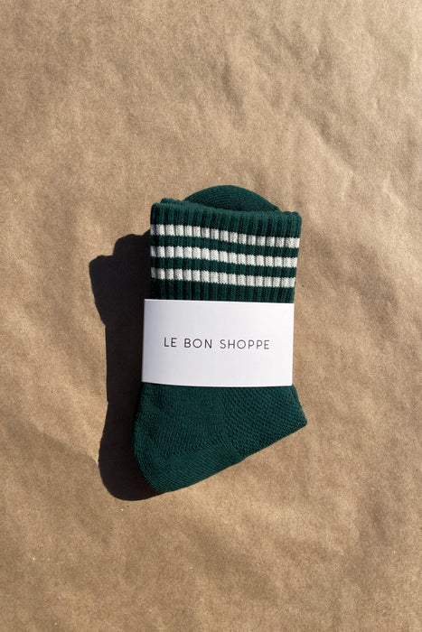 Pair of green socks with white stripes on a white background, featuring 'Le Bon Shoppe' label