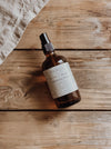 Brown glass bottle with a label on a wooden surface