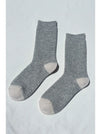 Pair of grey socks on a white background