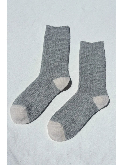 Pair of grey socks on a white background
