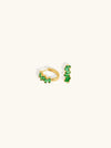 A pair of gold-plated hoop earrings featuring a geometric design with a row emerald stones.