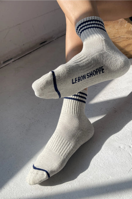 Grey socks with 'LE BON SHOPPE' branding on a light background
