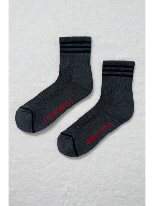 Pair of grey socks with black stripes andcred text on a white background
