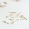Set of small ceramic spoons on a light background