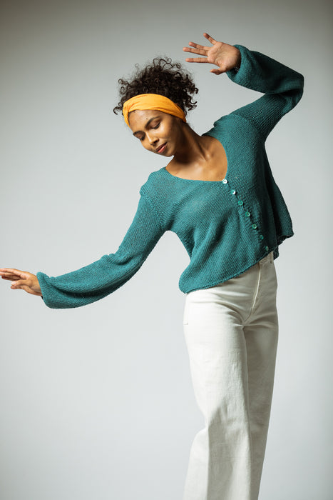 The hand knitted organic cotton cardigan in Turquoise
